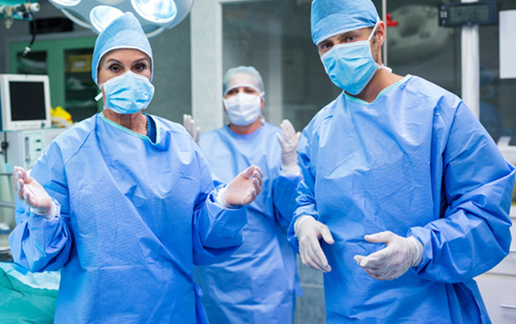 Portrait of surgeons preparing for operation in operation room